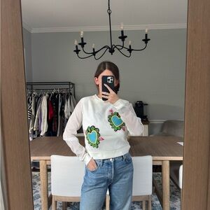 White Sweatshirt with Green Floral Accents